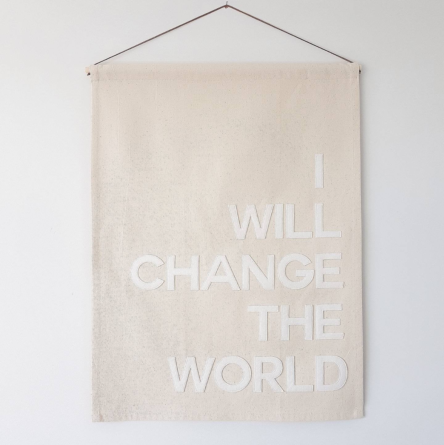 We/I will change the world banner in bold single colour text