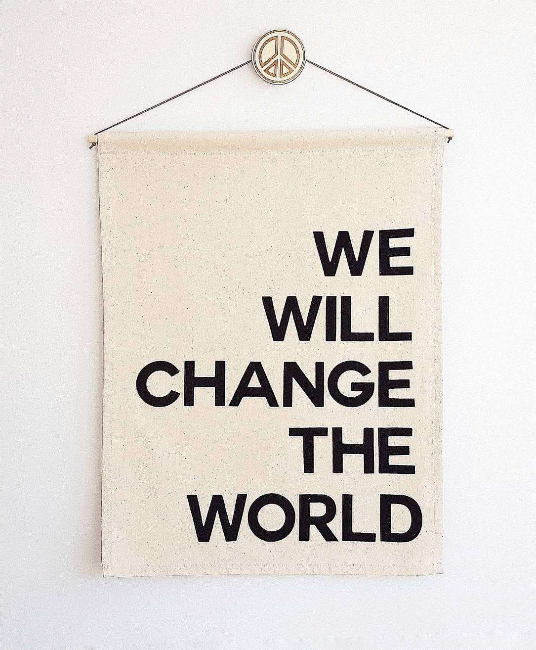 We/I will change the world banner in bold single colour text