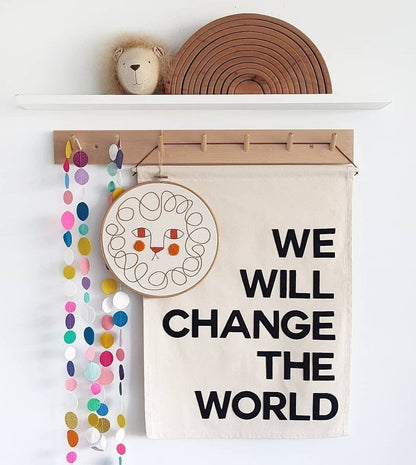 We/I will change the world banner in bold single colour text