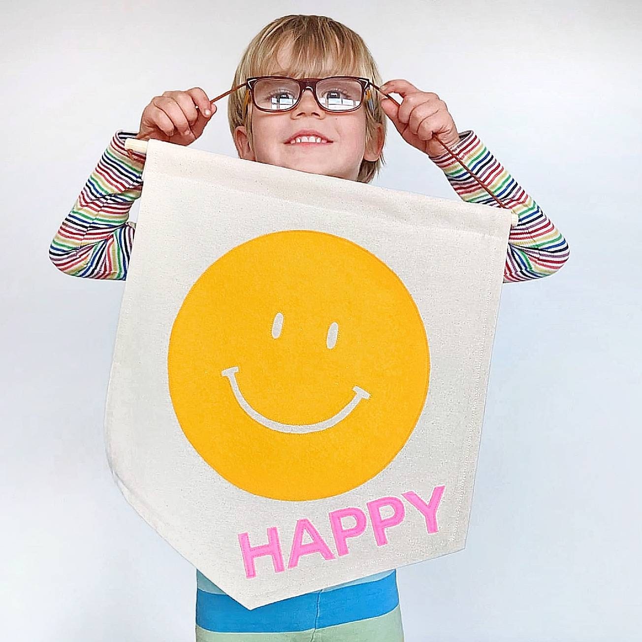 Smiley face happy banner in your choice of 2 colours.